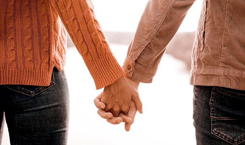 A couple holding hands