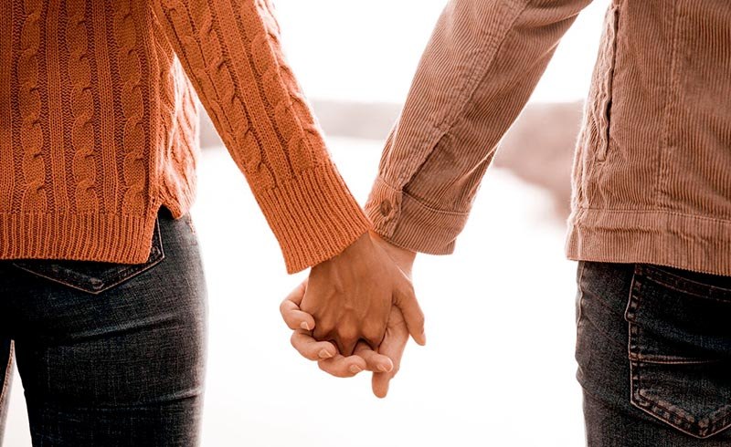 A couple holding hands