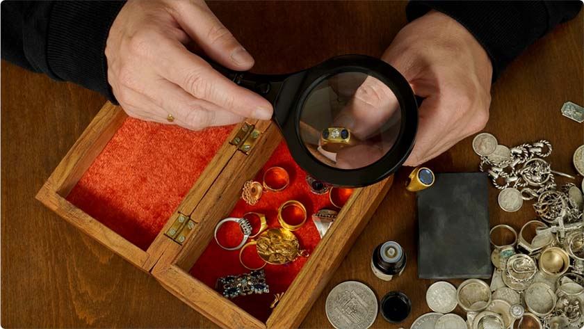 A man checks the authenticity of an expensive ring